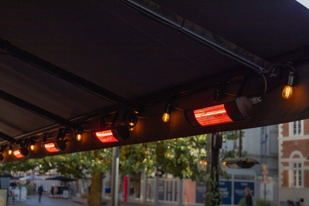 Ceiling-mounted Patio Heater units glowing above outdoor seating area in Phoenix, AZ