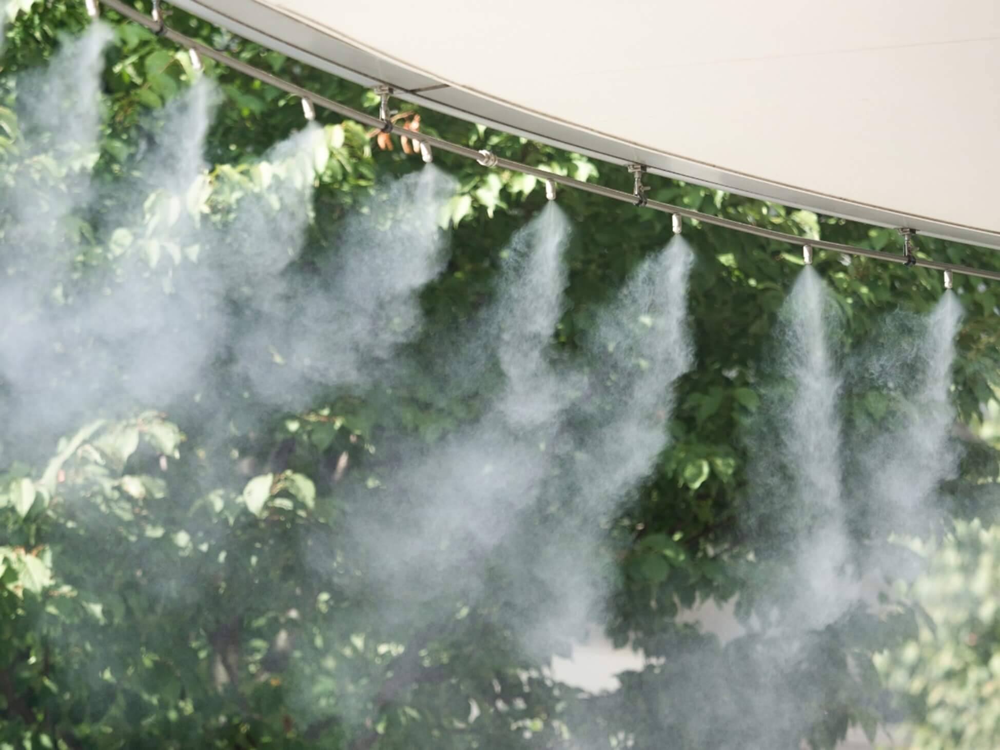 Close-up of a sprayer releasing water mist, part of a Mist Cooling System in Phoenix, AZ
