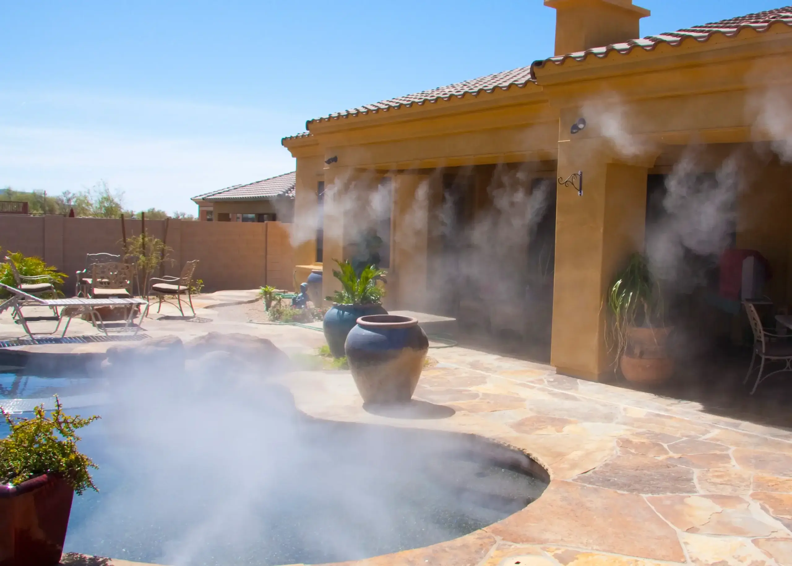 High-Pressure Misting Systems cooling a sunny patio in Phoenix, AZ