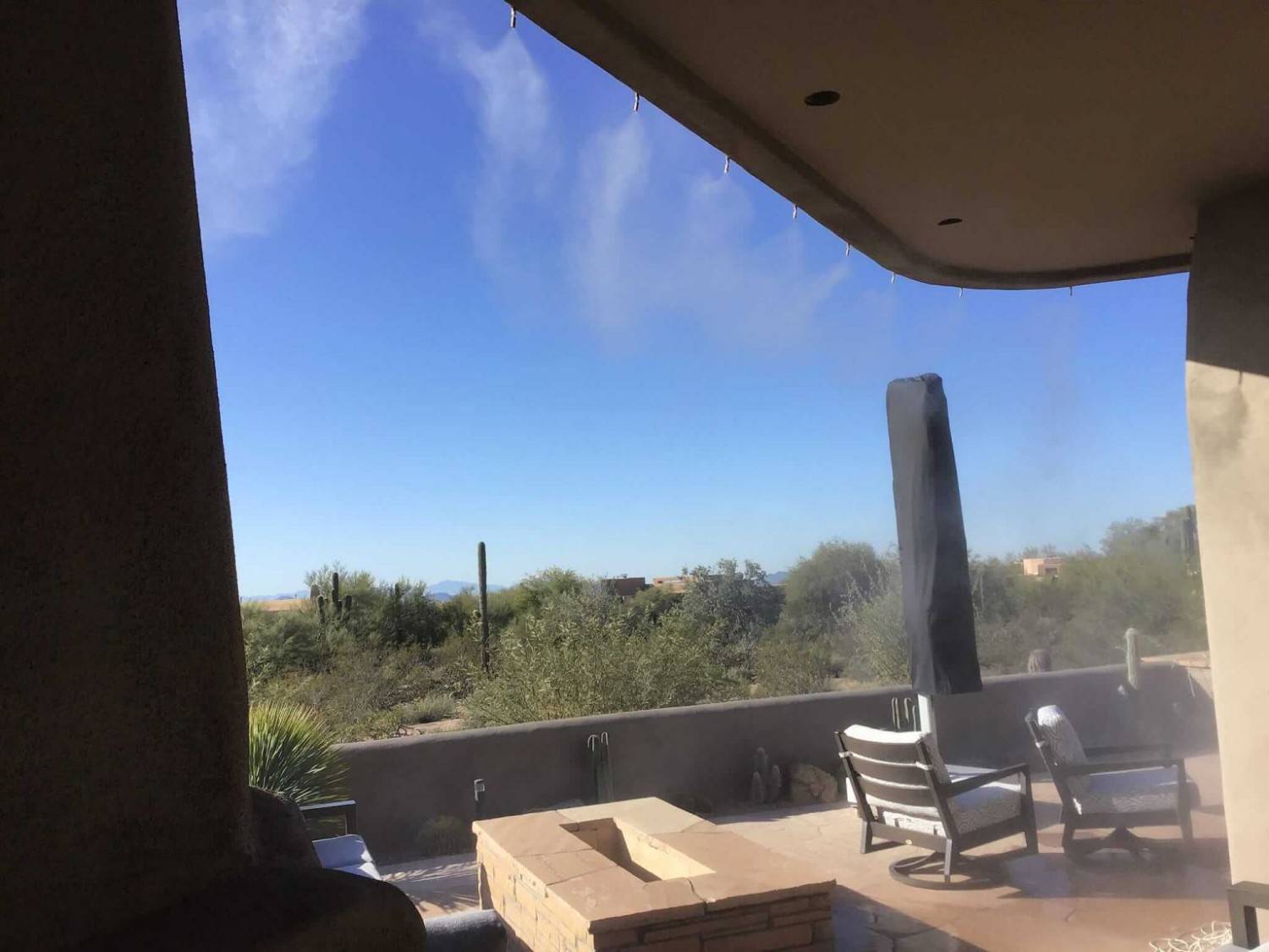 mistcurtain Covered patio with Mist Curtain cooling system and desert landscape in Phoenix, AZ