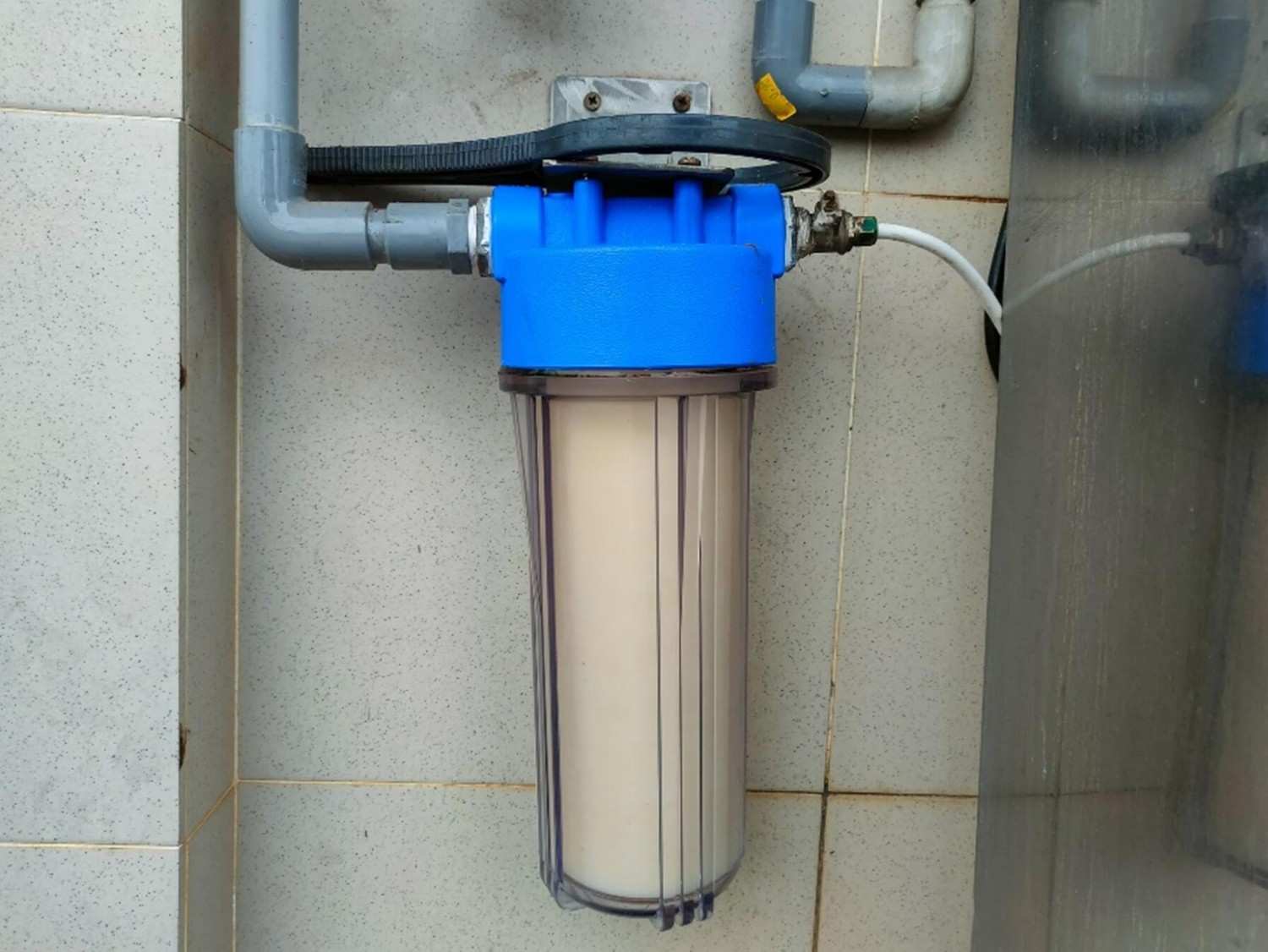Wall-mounted Water Filter system with pipes and cartridge for home use in Phoenix, AZ